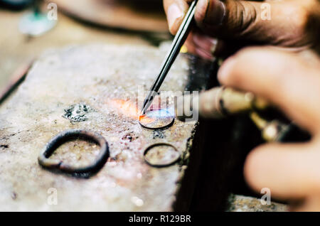 Industrial manufacture of the gold ring. Manufacture of a gold product in the jewelery workshop. Stock Photo