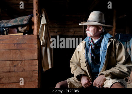 WY02428-00....WYOMING - Mike Buckich in the barn at the Willow Creek Ranch. MR# B18 Stock Photo