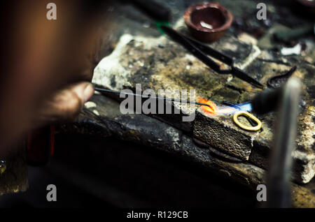 Industrial manufacture of the gold ring. Manufacture of a gold product in the jewelery workshop. Stock Photo