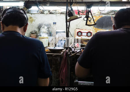 Jewelers at work, craftsmanship in a jewelry workshop, Jewelers in full action Stock Photo