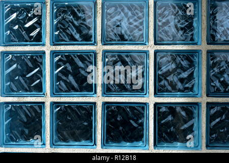 Blue glass bricks texture. Blue bricks background. White lines. Stock Photo