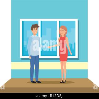 Male and female teachers standing in front of blank school blackboard ...