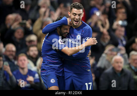 Chelsea's Pedro (left) celebrates scoring his side's third goal of the game with team mate Mateo Kovacic during the Premier League match at Stamford Bridge, London. Stock Photo