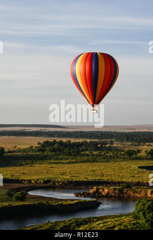 Air balloon floating over Mara River, Kenya Stock Photo