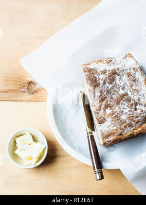 Freshly baked bread with butter Stock Photo