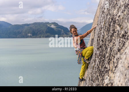 Woman rock climbing, Squamish, Canada Stock Photo