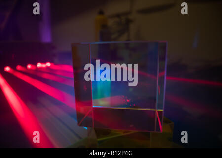 Red laser on optical table in physics laboratory, solid-state laser ...