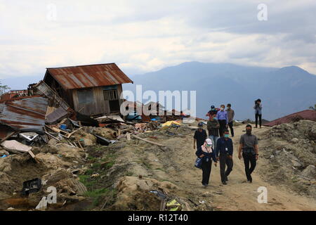 November 1, 2018 - Palu, Central Sulawesi, Indonesia - Head of the Indonesian Information Agency, Mr. Hasannudin Z. Abidin seen reviewing the locations where the earthquake happened..A deadly earthquake measuring 7.5 magnitude and a tsunami wave destroyed the city of Palu and much of the area in Central Sulawesi. The death toll was 2088, around 5000 people were seriously injured and some 62,000 people were displaced. (Credit Image: © Risa Krisadhi/SOPA Images via ZUMA Wire) Stock Photo