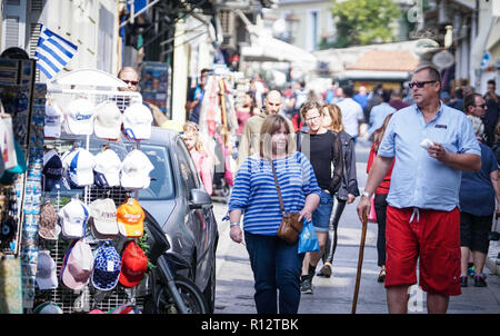 October 22, 2018 - Athens, Attiki, Greece - Tourists seen walking through the city center of Athens..The Acropolis of Athens is an ancient citadel located on a rocky outcrop above the city of Athens and contains the remains of several ancient buildings of great architectural and historic significance, the most famous being the Parthenon. (Credit Image: © Ioannis Alexopoulos/SOPA Images via ZUMA Wire) Stock Photo