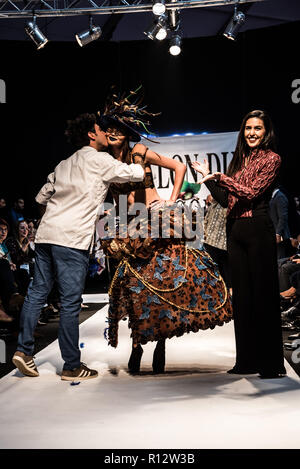 Beirut, Lebanon. 8th November, 2018. Model wearing a dress made from chocolate walks the runway at the Salon du Chocolat catwalk show in Beirut, Lebanon. These carefully designed garments have been painstaking put together by top Chocolatiers working with Lebanese fashion designers to create the perfect look for a carnival theme Credit: Elizabeth Fitt/Alamy Live News Stock Photo