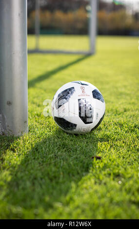 08 November 2018, North Rhine-Westphalia, Harsewinkel: A football with the imprints 'Telstar 18 Official Matchball' and 'Russia 2018' lies in front of a goal on the pitch during a training session of the German women's national soccer team. Photo: Friso Gentsch/dpa Stock Photo