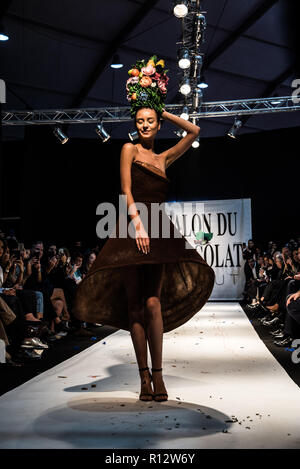 Beirut, Lebanon. 8th November, 2018. Model wearing a dress made from chocolate walks the runway at the Salon du Chocolat catwalk show in Beirut, Lebanon. These carefully designed garments have been painstaking put together by top Chocolatiers working with Lebanese fashion designers to create the perfect look for a carnival theme Credit: Elizabeth Fitt/Alamy Live News Stock Photo