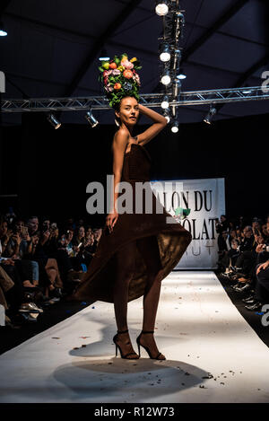 Beirut, Lebanon. 8th November, 2018. Model wearing a dress made from chocolate walks the runway at the Salon du Chocolat catwalk show in Beirut, Lebanon. These carefully designed garments have been painstaking put together by top Chocolatiers working with Lebanese fashion designers to create the perfect look for a carnival theme Credit: Elizabeth Fitt/Alamy Live News Stock Photo