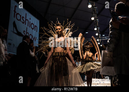 Beirut, Lebanon. 8th November, 2018. Model wearing a dress made from chocolate walks the runway at the Salon du Chocolat catwalk show in Beirut, Lebanon. These carefully designed garments have been painstaking put together by top Chocolatiers working with Lebanese fashion designers to create the perfect look for a carnival theme Credit: Elizabeth Fitt/Alamy Live News Stock Photo