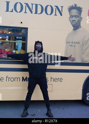 London, 8th November 2018. Mr Eazi, singer songwriter from Nigeria, with a tremendous following and viewing on YouTube is releasing the album ‘Lagos to London’ on 9th November. The mixtape has 15 tracks of African tradition, Afrobeat and R&B. The celebration of the new record starting at Marble Arch today. Credit: Joe Kuis / Alamy Live News Stock Photo