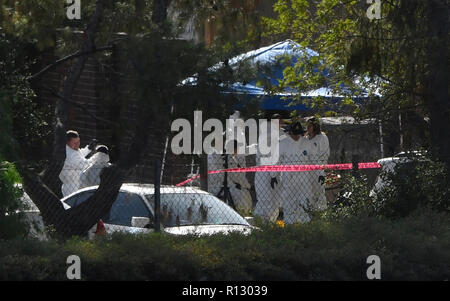 Crime scene investigators work at the scene of a shooting on 16th and ...