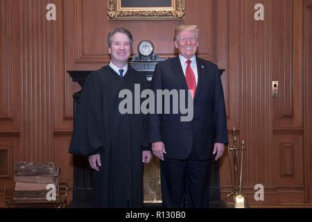 Washington DC, USA. 8th Nov 2018. U.S President Donald Trump poses with Supreme Court Associate Justice Brett Kavanaugh before the investiture ceremony November 8, 2018 in Washington, DC. Credit: Planetpix/Alamy Live News Stock Photo