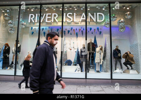 Oxford Street, London, UK 9 Nov 2018 - A quiet Oxford Street with 45 days to Christmas. Shoppers walk past River Island store on Oxford Street.  The retail sector faces difficulties as consumers cut down on spending and do more of their shopping online.  A report by accountancy firm PWC has says that over 1,000 stores disappeared from Britain's top 500 high streets in the first six months of the year.  Credit: Dinendra Haria/Alamy Live News Stock Photo