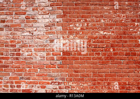 Handmade red brick wall showing efferescence, the powdery substance caused by moisture Stock Photo