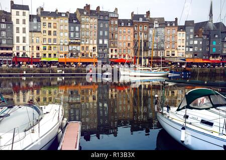 HONFLEUR, FRANCE - APRIL 8, 2018: view of the bay and the embankment  in the famous French city Honfleur. Normandy, France Stock Photo