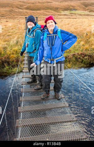 The suspension bridge across the Lon Mor in Strath Shinary giving ...