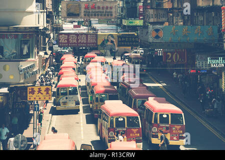 Hong Kong, China - August 14, 2017: Minibuses lining up, waiting for passengers at a busy station in Mongkok, Hong Kong, China Stock Photo