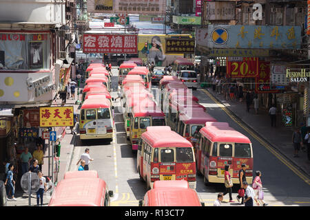 Hong Kong, China - August 14, 2017: Minibuses lining up, waiting for passengers at a busy station in Mongkok, Hong Kong, China Stock Photo