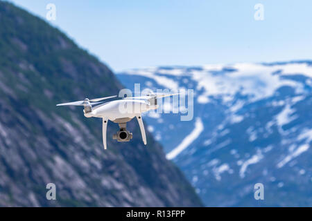 Jostedal, Norway - June 2 2018 : Drone quadcopter DJI Phantom 4 Pro with 4K digital camera while flying over the Nigardsbreen glacier, Norway Stock Photo