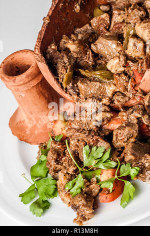 Authentic Turkish Testi Kebab cooked in earthenware waterjug Stock Photo