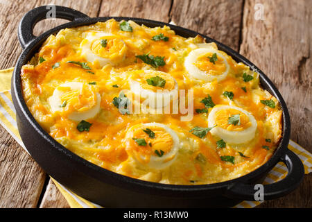 Welsh casserole Anglesey eggs baked with mashed potatoes, cheese sauce with leek close-up on the table. horizontal Stock Photo