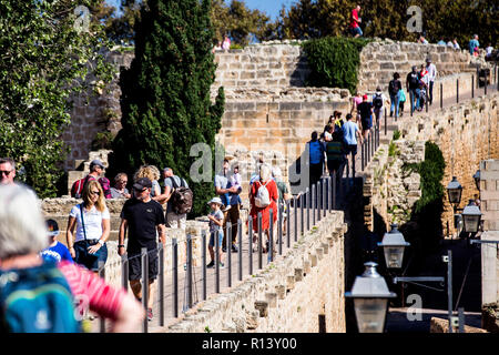 People walking on city walls in the Alcudia old town, Mallorca Stock Photo