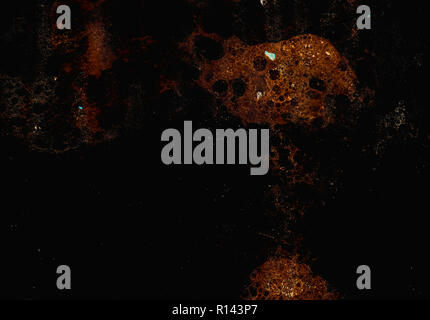 Abstract grunge cellular background against black Stock Photo