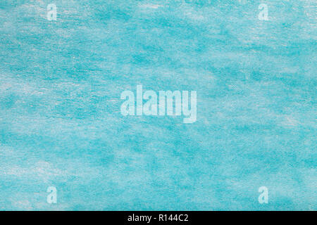 Construction of a light blue background with white spots of felt fabric, closeup. Texture of woolen matt textile. Cloth backdrop. Stock Photo