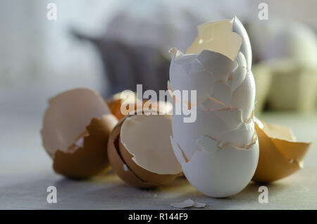 Close up of broken egg shells on wooden background,blurred background. Stock Photo