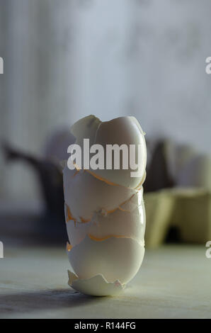Close up of broken egg shells on wooden background,blurred background. Stock Photo