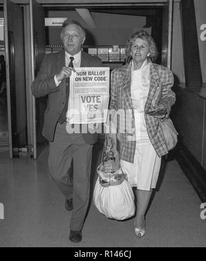Arthur Scargill, President of the mineworkers union leaving Heathrow Airport with his wife Anne in 1987. Stock Photo