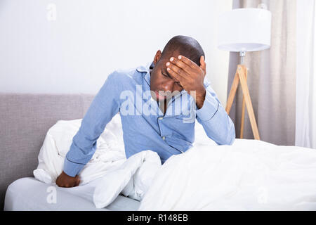 Close-up Of A Young African Man Suffering From Headache Stock Photo