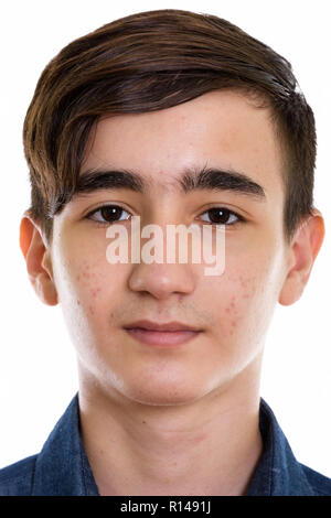 Face of young handsome Persian teenage boy Stock Photo