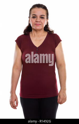 Studio shot of mature Persian woman standing Stock Photo