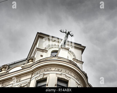 View of a reindeer statue on top of a building in Vienna in a cloudy day Stock Photo