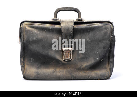 Leather retro briefcase, black color, covered with dust, flapover style, isolated on white background with shadow, front view Stock Photo