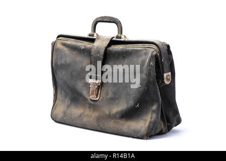 Retro business briefcase, view in angle, covered with dust, black leather flapover, isolated on white background, with shadow, Stock Photo