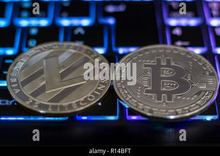 Cryptocurrency coins on computer keyboard Stock Photo