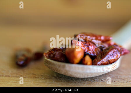 Dried red chili on wooden board Stock Photo