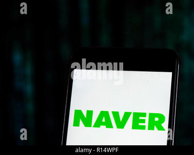 Naver Internet company logo seen displayed on smart phone. Naver Corporation is an Internet content service company headquartered in Seongnam, South Korea that operates the Korean search engine Naver. Naver established itself as an early pioneer in the use of user-generated content through the creation of the online Q&A platform Knowledge iN. Stock Photo