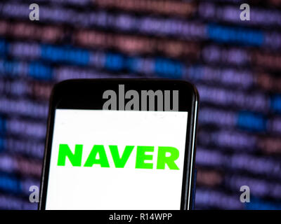 Naver Internet company logo seen displayed on smart phone. Naver Corporation is an Internet content service company headquartered in Seongnam, South Korea that operates the Korean search engine Naver. Naver established itself as an early pioneer in the use of user-generated content through the creation of the online Q&A platform Knowledge iN. Stock Photo