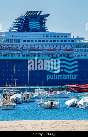 Big ship from a company Pullmantur, names Zenith, on a harbor a small Spanish town Palamos in Costa Brava. 10. 03. 2018 Spain Stock Photo