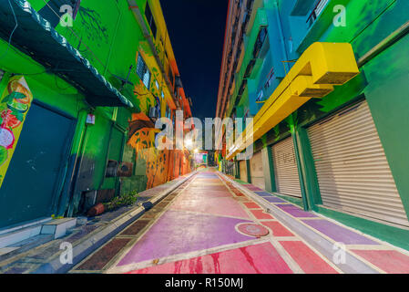 KUALA LUMPUR, MALAYSIA - JULY 23: Alley with Colorful street art on the Lost Stream of Jalan Alor at night on July 23, 2018 in Kuala Lumpur Stock Photo