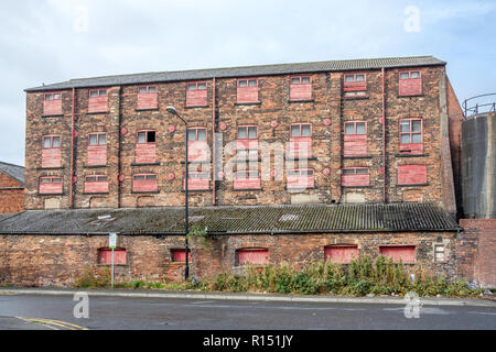 Old factory buildings in the vicinity of Granary Wharf in the city centre of Leeds, which is the largest town in West Yorkshire. Stock Photo