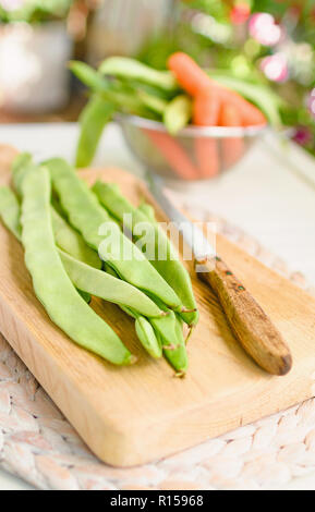 Green runner beans lying on a tray Stock Photo